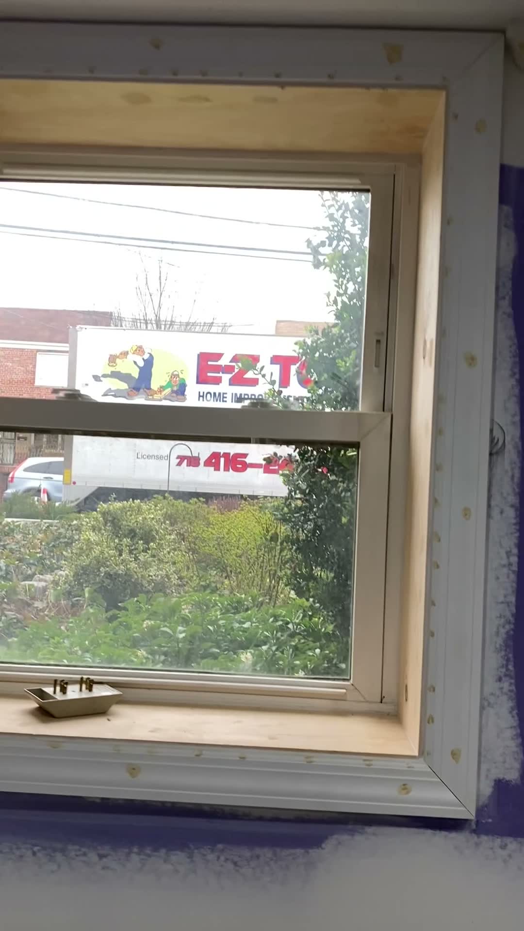 New window installed, with the E-Z Touch truck parked on the street outside