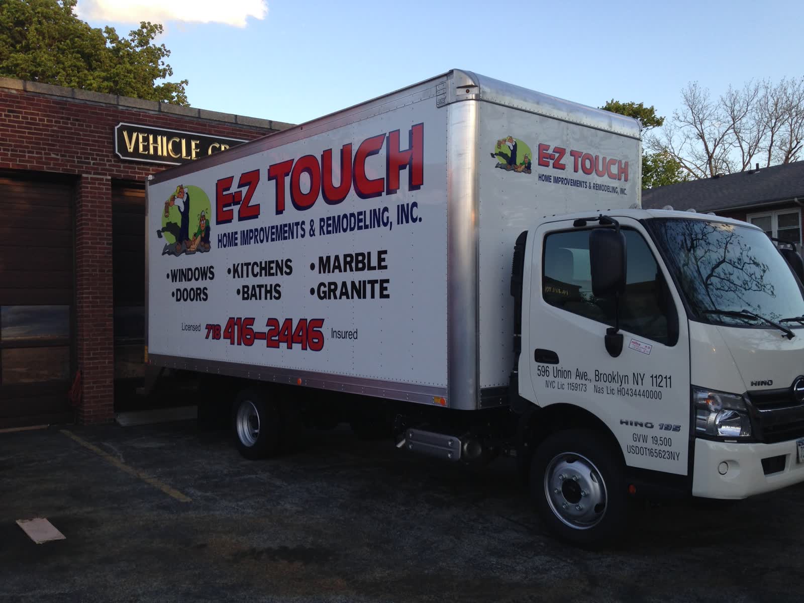 E-Z Touch box truck lettered with windows, doors, kitchens, baths, marble and granite